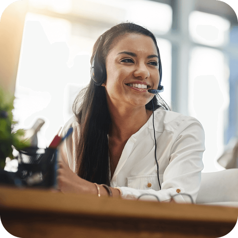A female customer support representative is talking on a wired headset to an Eweka user, helping them with their Usenet service.